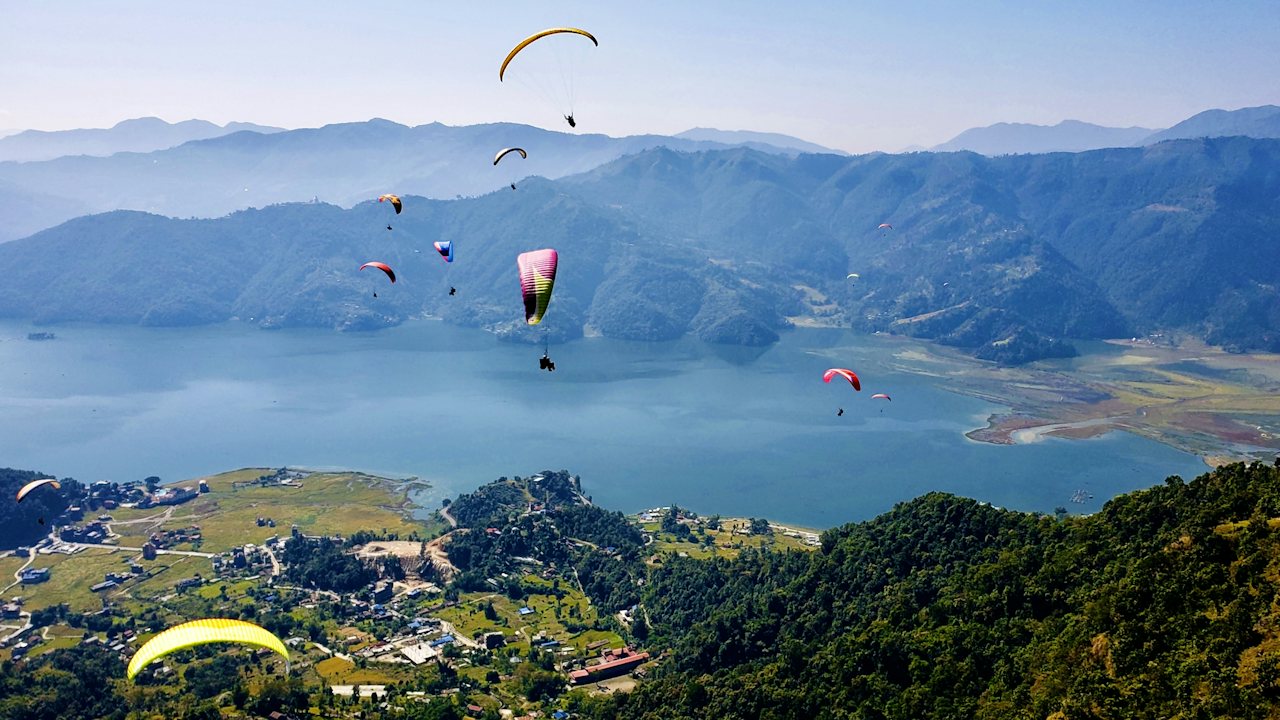 Paragliders over Phewa Lake and the hills of Pokhara